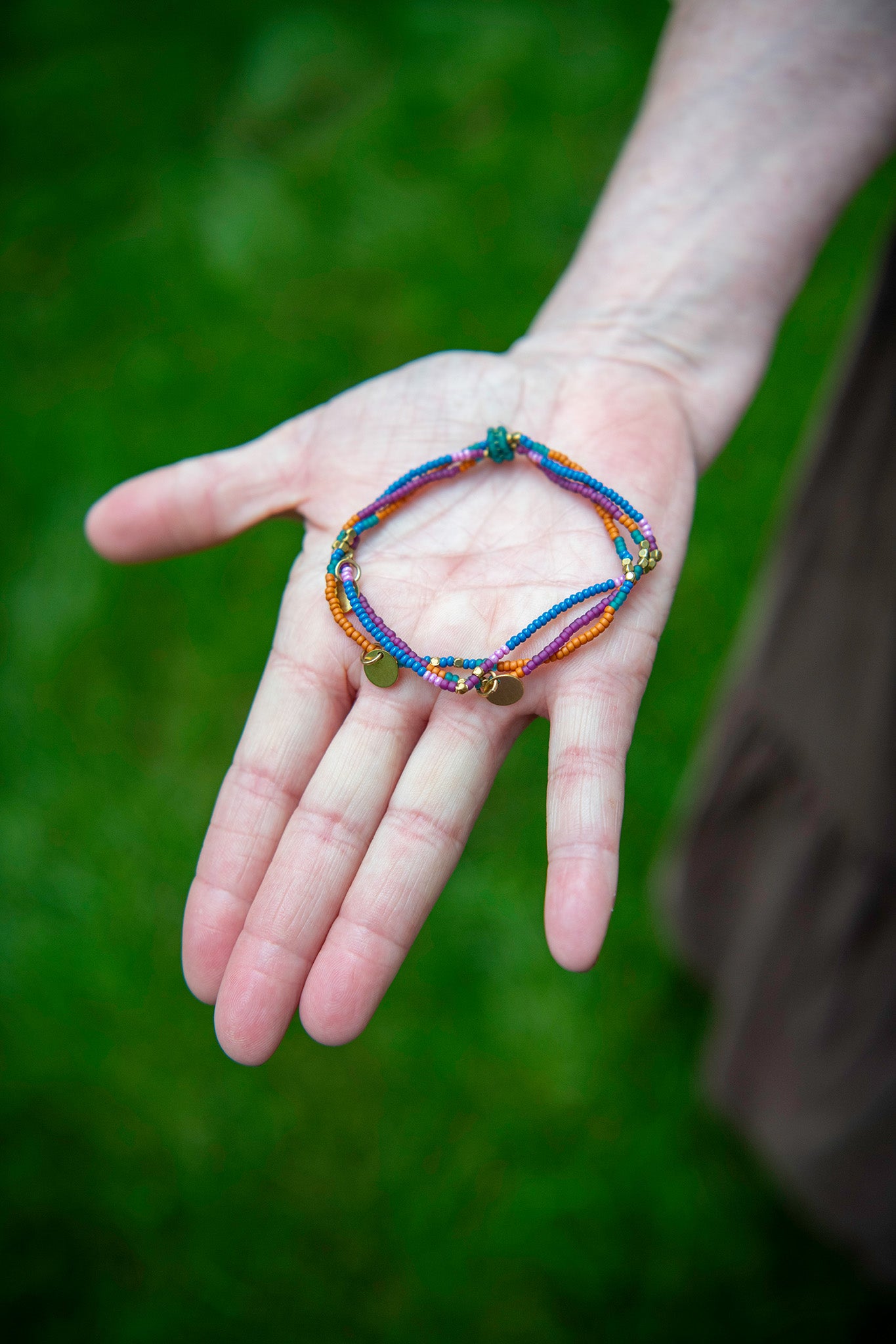 Free-Trade Triple Strand Beaded Bracelet in Deep Jewel